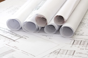 A architect's workspace with plans and designs