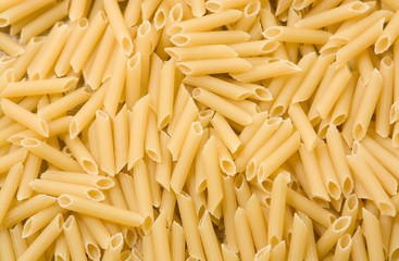 Penne rigate pasta background