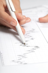 woman’s hand holding a pen