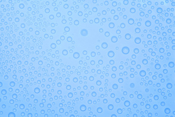 Abstract blue background with many water bubbles.