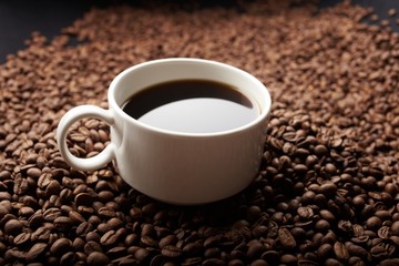 Fototapeta premium coffee beans with white cup
