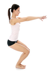 Fototapeta na wymiar Young woman doing exercise