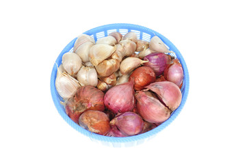 A Basket On Red Onions And Garlic