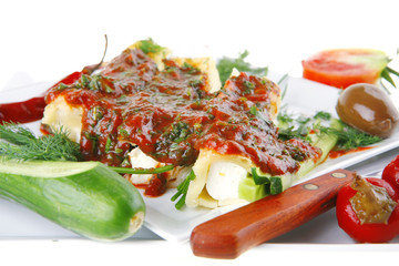 cannelloni served on square white plate