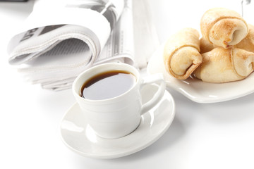 Cup of fragrant coffee on a morning paper business news