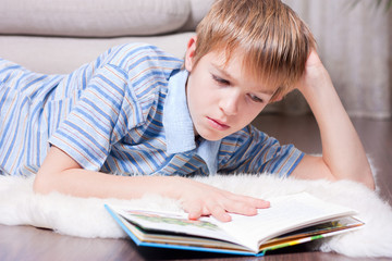 Teen reading a book.