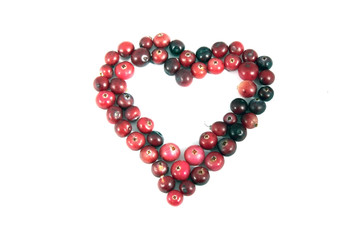 heart shape ripe red cranberry over white