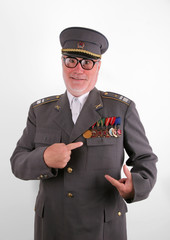 Uniformed soviet soldier in eyeglasses show his medals