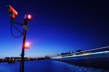 Thames in London at night by a pier