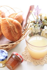WheatBread roll in basket and grapefruit juicy