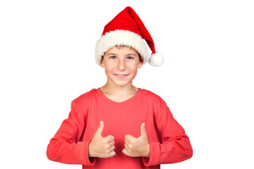 Adorable child with Santa Hat saying Ok