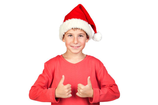 Adorable child with Santa Hat saying Ok