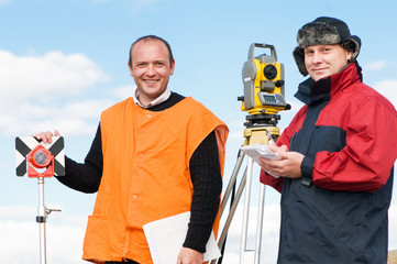 surveyor workers with theodolite equipment