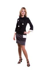 Brunette businesswoman dressed in black dress.