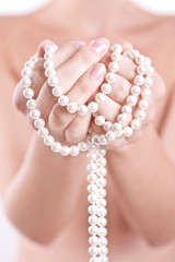 pearls in the women's hands