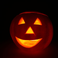 Jack-o-lantern glowing on black background