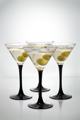 Martini with olives on a white background