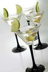 Martini with olives on a white background