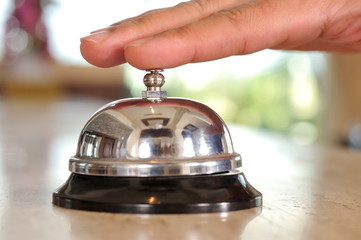 Hand of a man using a hotel bell - a series of HOTEL images.