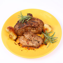 Roast pork with rosemary, onions and colorful peppercorns