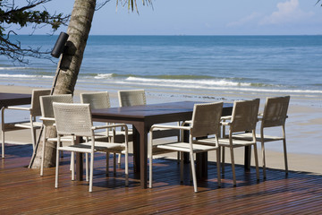 Table and chairs in empty cafe at island Koh Chang , Thailand.