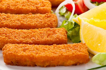 Fried fish fingers and vegetables