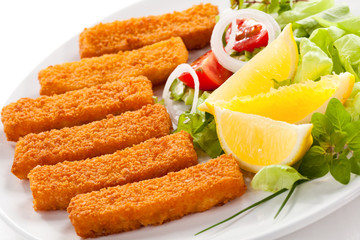Fried fish fingers and vegetables