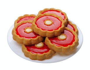 Obraz na płótnie Canvas Cookies with red jelly on white plate, isolated