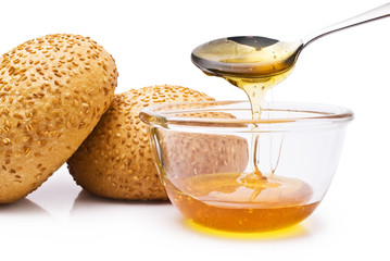 bun with sesame seeds and honey