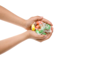 キャンディーを持つ子供の手