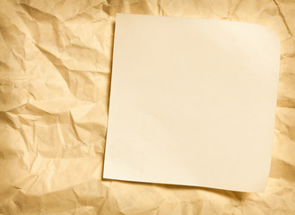 paper note on wrinkled paper background
