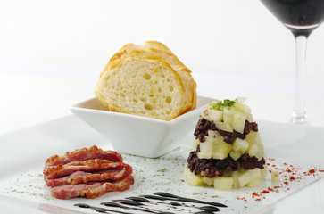 Apples, blood sausage, duck meat and baguette