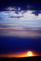 Sun Setting with Clouds