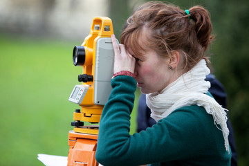 young land surveyor at work