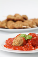 Roast meatballs with tomato sauce. Shallow DOF
