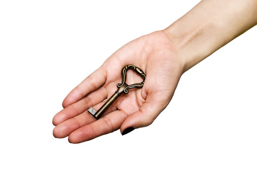 Woman's hand holding an antique shape key