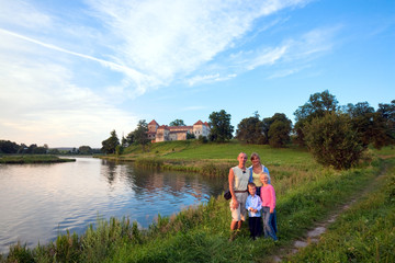 Family and evening Svirzh Castle (Ukraine).