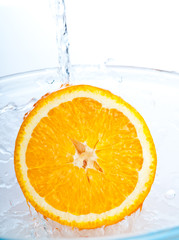 orange into water splash