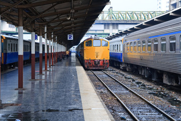 Fototapeta na wymiar Retro orange train, diesel locomotive, on Bangkok station