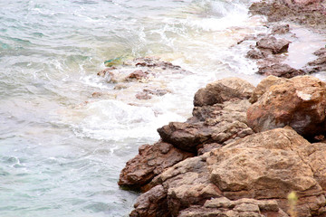 Fototapeta na wymiar Waves on the Greek seashore