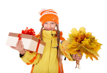 Child holding orange leaves and gift box.