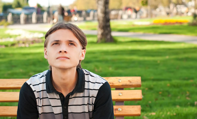 Teenager on the bench in the park