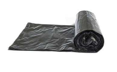 Roll of disposable trash bags isolated over white