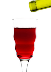 red wine pouring into glass isolated