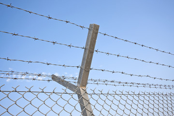 Chainlink and barbed wire fence