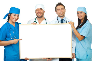 Team of doctors with blank banner