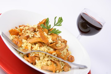 Risotto with mushrooms with parsley and a glass of red wine
