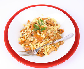 Risotto with mushrooms decorated with parsley and a fork