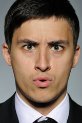 Obraz premium Portrait of stressed business man in formal suit and black tie.