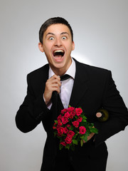 Expressions. Happy romantic husband holding rose flower and vine